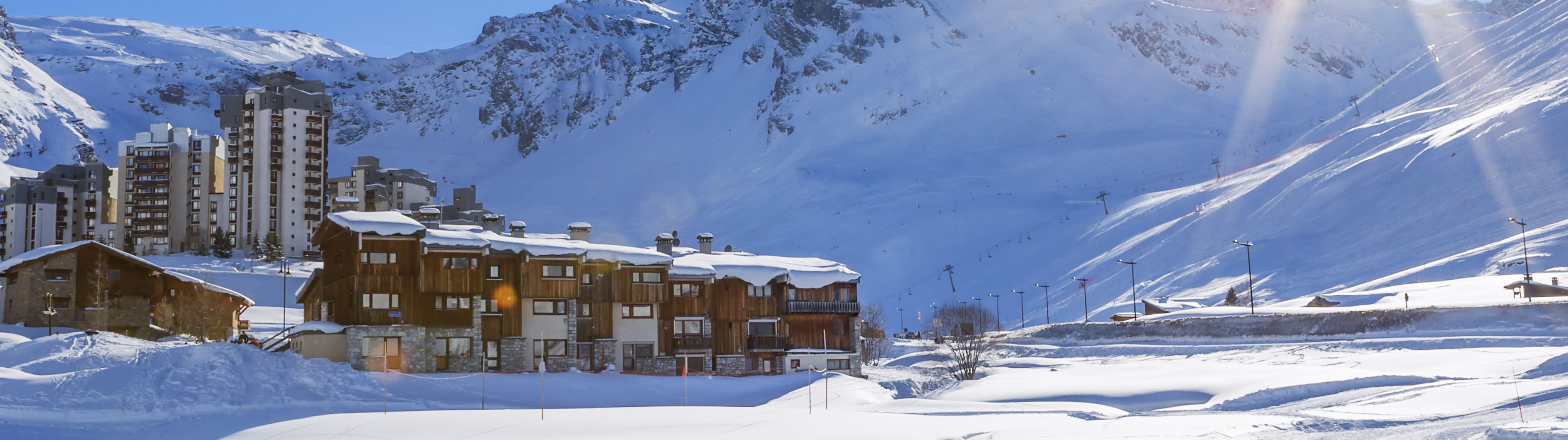 Private cabins lie before snow-packed slopes in Tignes.