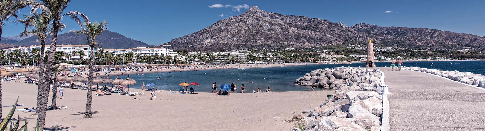 The beautiful beaches and dry hills of Marbella on a clear summer's day.