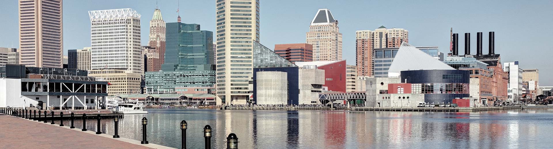 View of Baltimore city center skyscrapers with the harbor at the forefront.