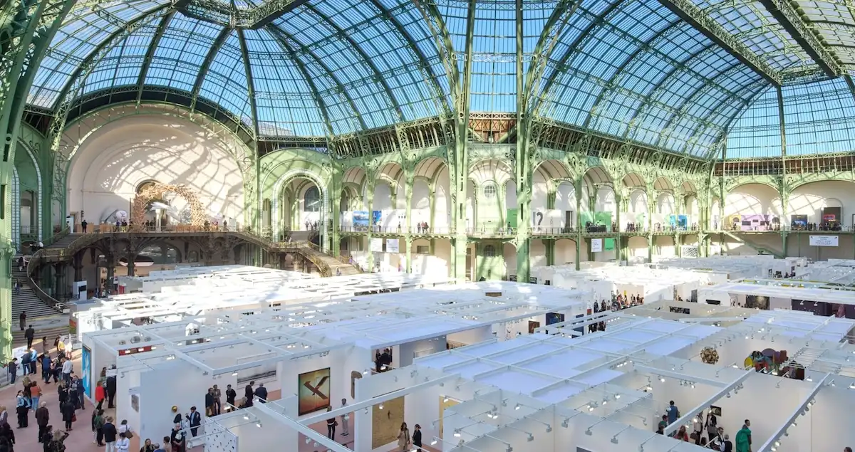 Interior shot of the ArtBasel Paris exhibition inside the Grand Palais, showing all of the booths from above.