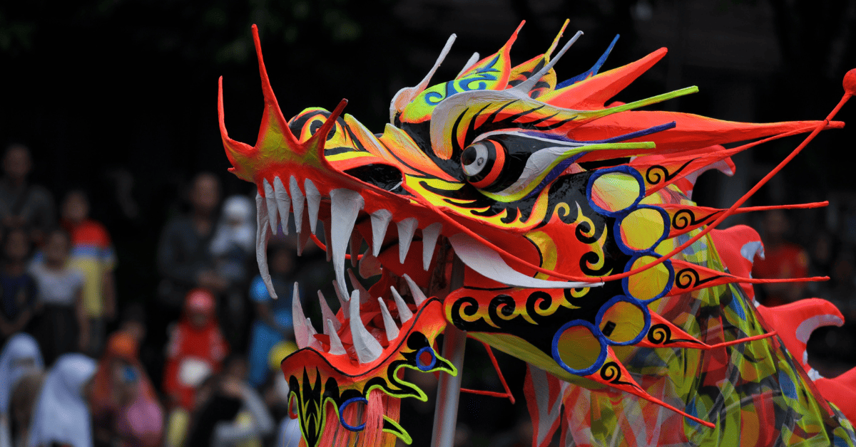 <figcaption class="wp-element-caption">The dragon dance symbolizes good fortune and strength in festive traditions. <em>Image credit: Donny Haryadi/Unsplash</em></figcaption>