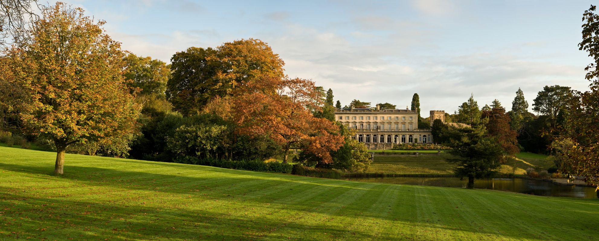 A beautiful old manor house hotel in autumnal British countryside.