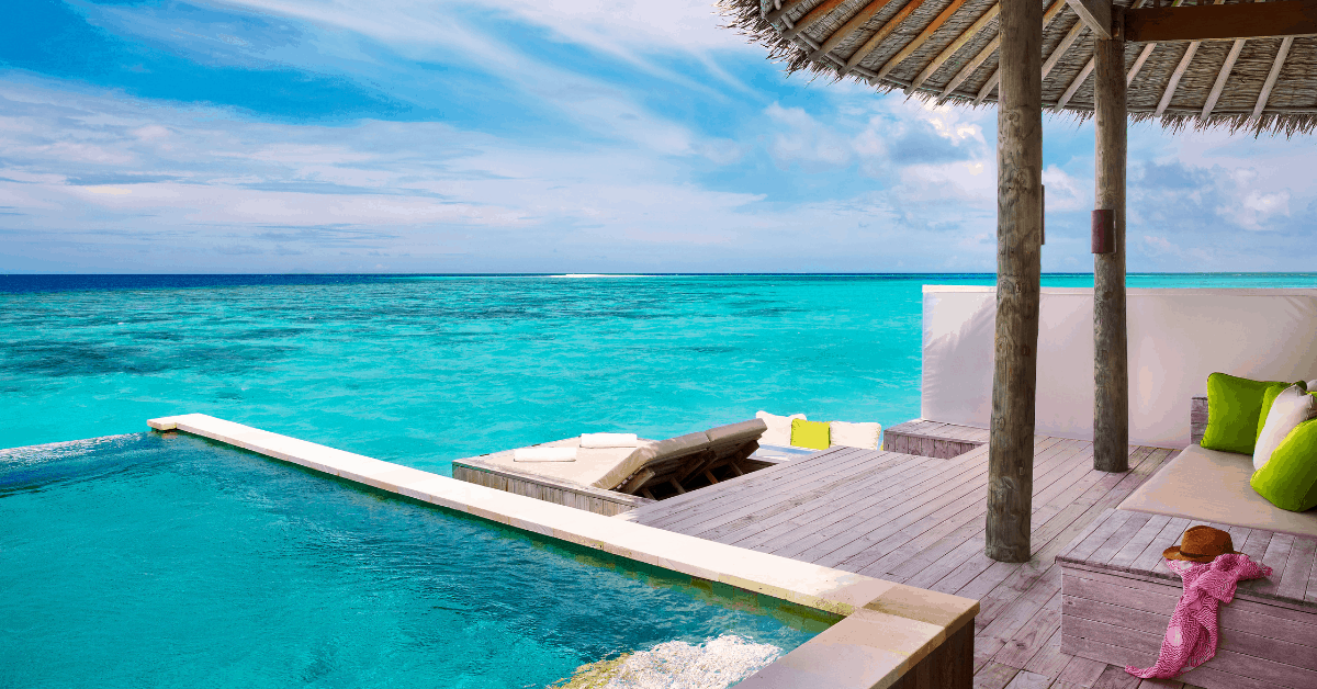 <figcaption>The view from the water villa at Laamu Six Senses<em>. Image credit: Laamu Six Senses</em></figcaption>