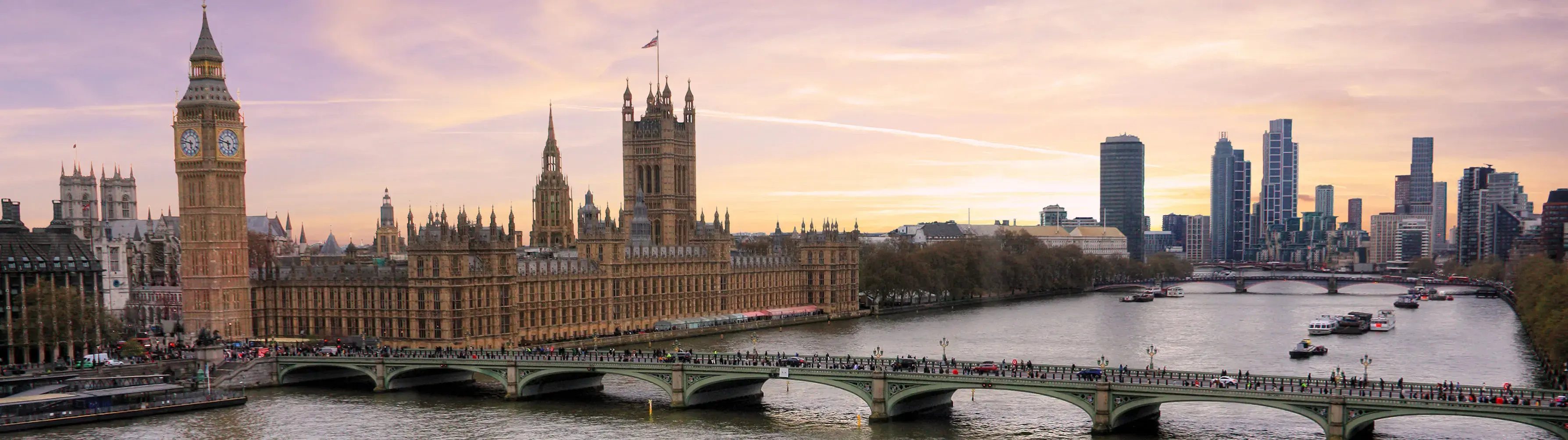 The Houses of Parliament and the River Thames at sunset.