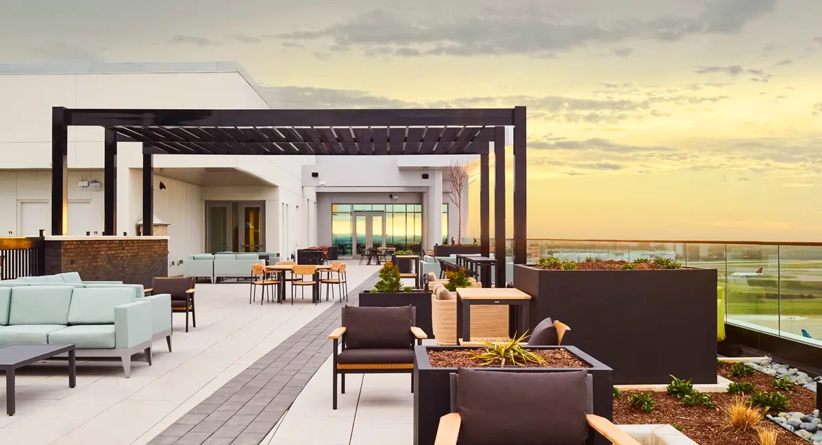 An image of the Sky Pavilion at the Hilton BNA Nashville Airport Terminal Sky Pavilion at dusk. 