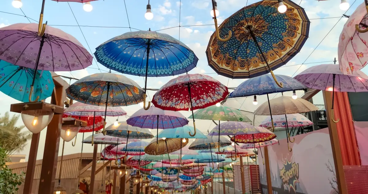 A roof of colourful umbrellas above a street in Boulevard World, Riyadh.