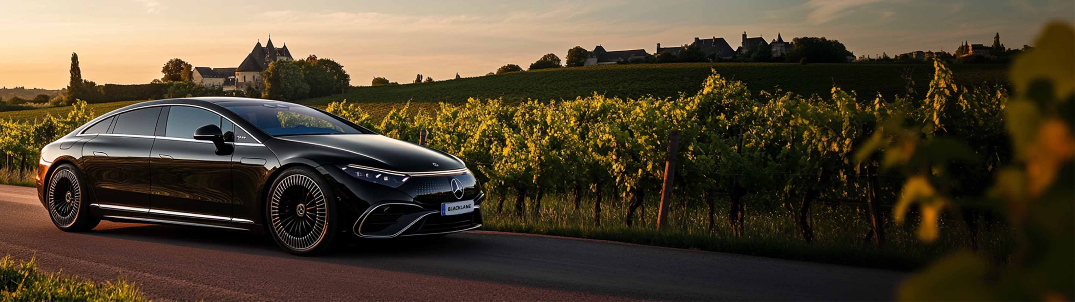 A Blacklane Mercedes limo travels past vineyards from Bordeaux to St Émilion.