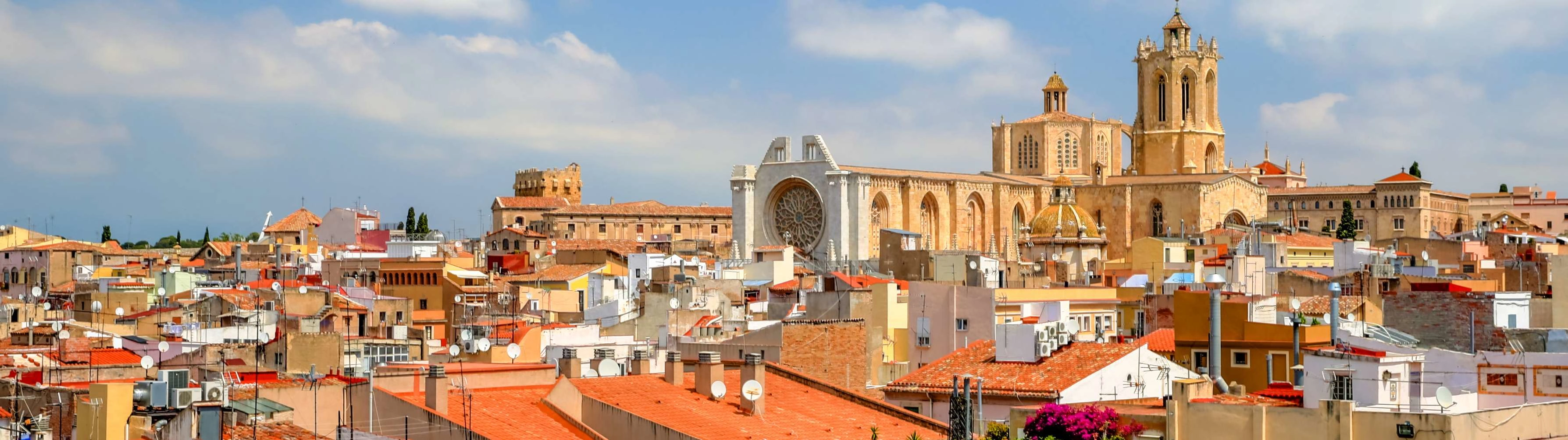 A beautiful church sits among red roof tops in Tarragona.