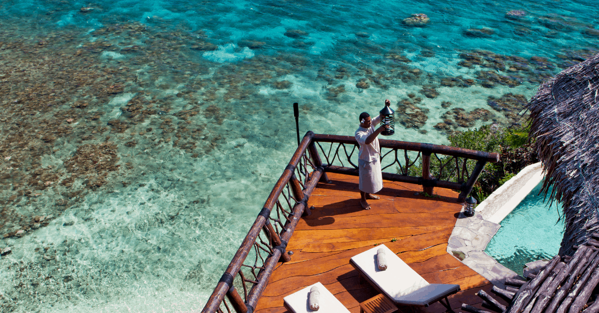 <figcaption>Relax on a deck overlooking the ocean, knowing everything has been taken care of. <em>Image credit: Laucala Island Resort</em></figcaption>