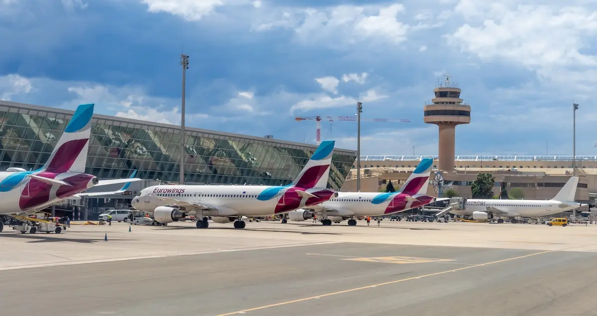 Eurowings passenger planes on the tarmac in front of the airport terminal in Palma de Mallorca Airport in Spain.

