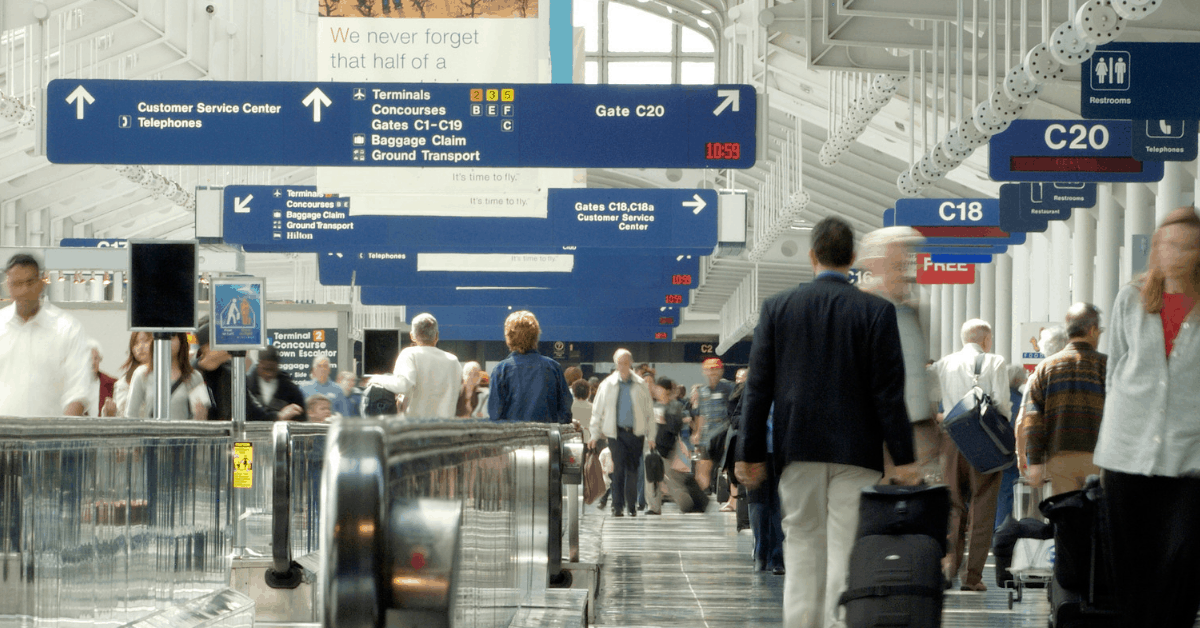 <figcaption class="wp-element-caption">Walking through Chicago O'Hare Airport<em>. Image credit: groveb/iStock</em></figcaption>