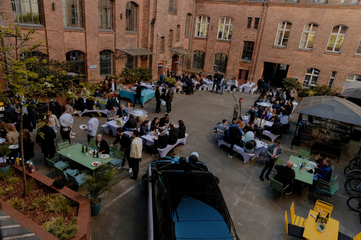  A crowd of Blacklaners gathered in a courtyard for a barbecue.