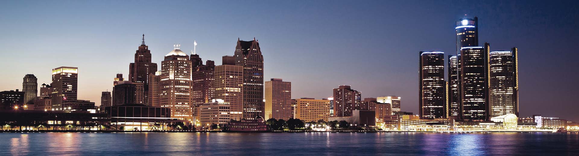 An array of skyscrapers light up the night sky above Detroit.