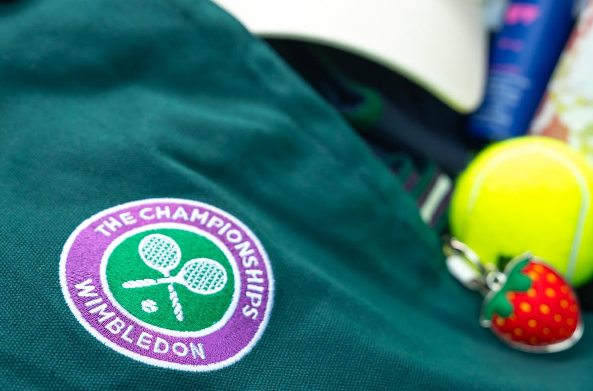 Some of the swag from the Blacklane Ace package - a Polo Ralph Lauren Wimbledon collection ball boy jacket, strawberry keyring, and a tennis ball souvenir.