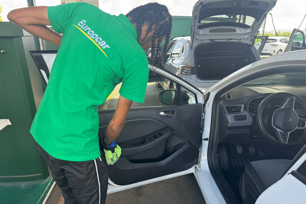 Cleaning an Europcar Martinique rental car