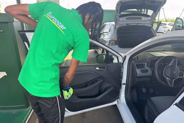 Cleaning an Europcar Martinique rental car
