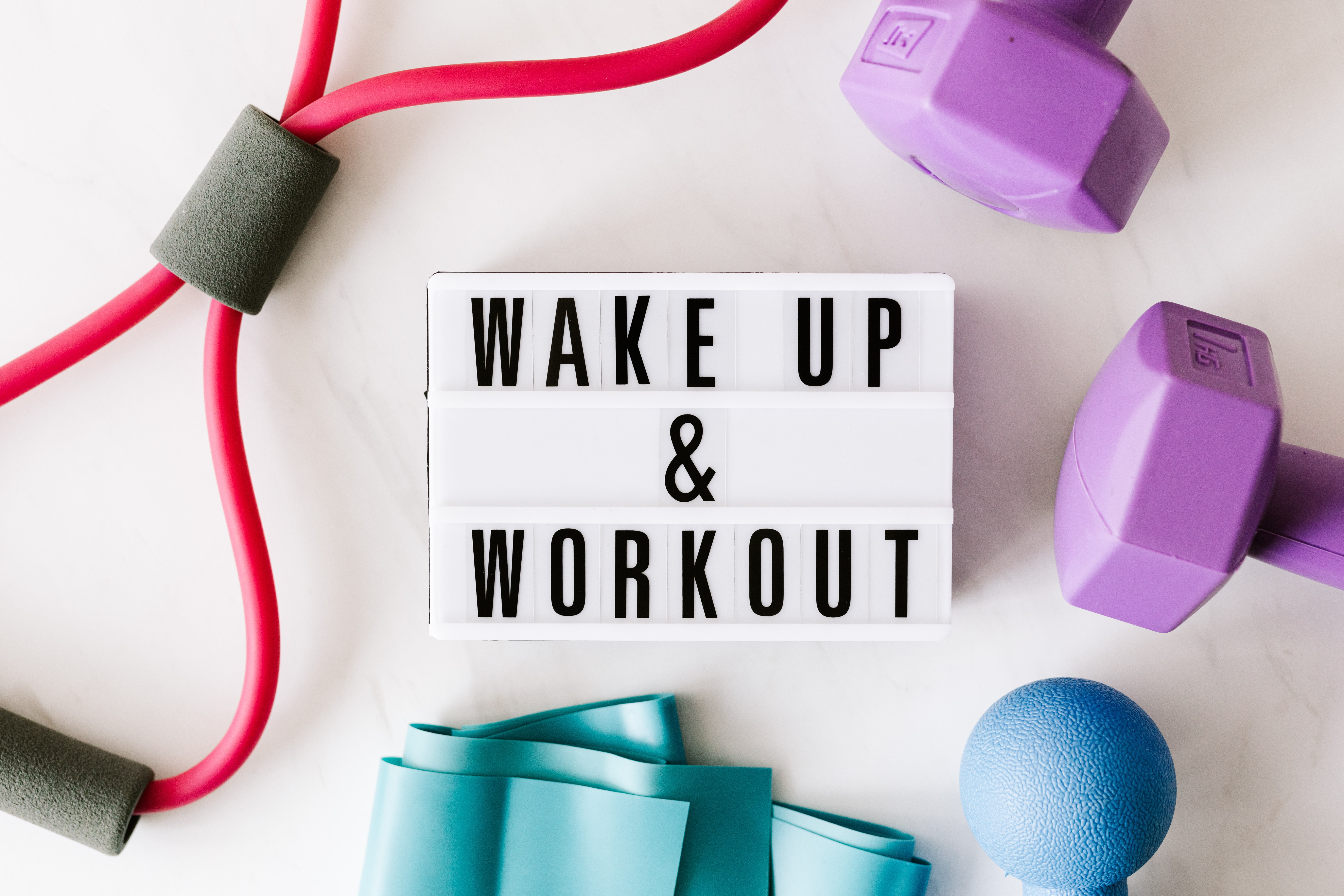 Sign which says 'wake up & workout'