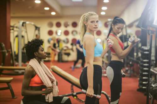 Woman working out with friends in the Gym