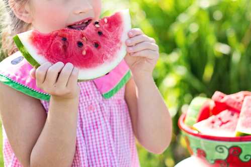 Child eating water melon