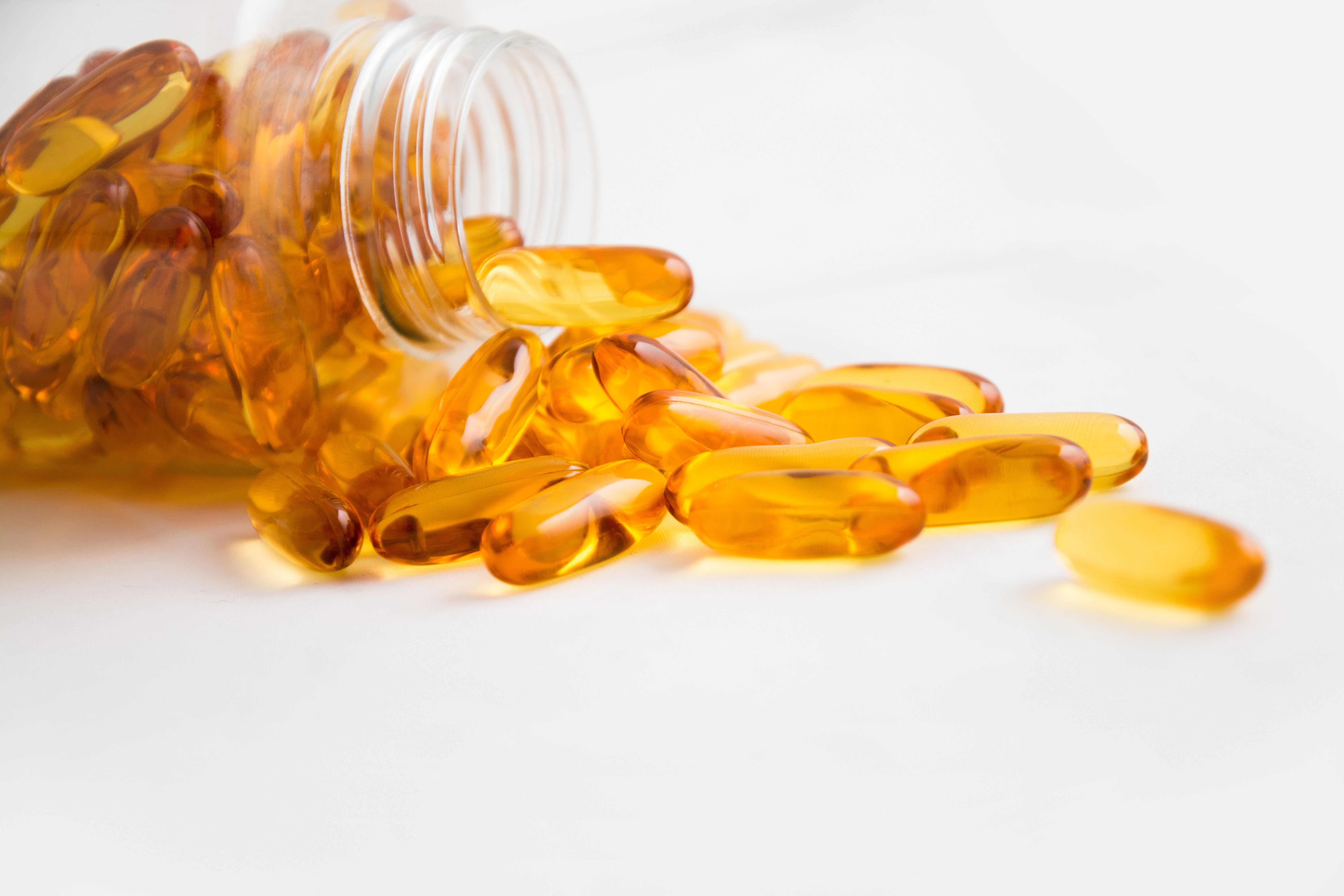 Omega fish oil capsules in a tub