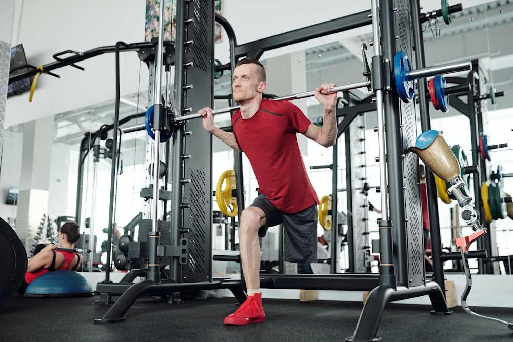 Personal training client doing squats