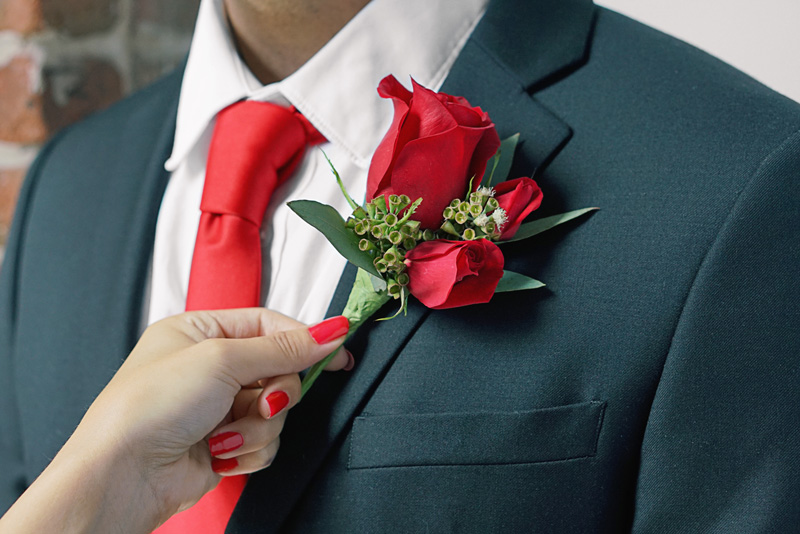 how to put on a boutonniere on a dress shirt How to Pin a Boutonniere StudioSuits