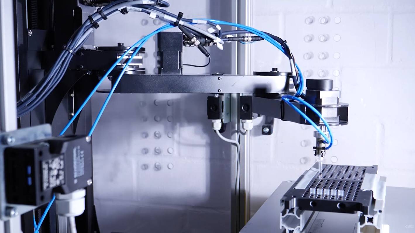 Scara robot picking and placing test tubes 