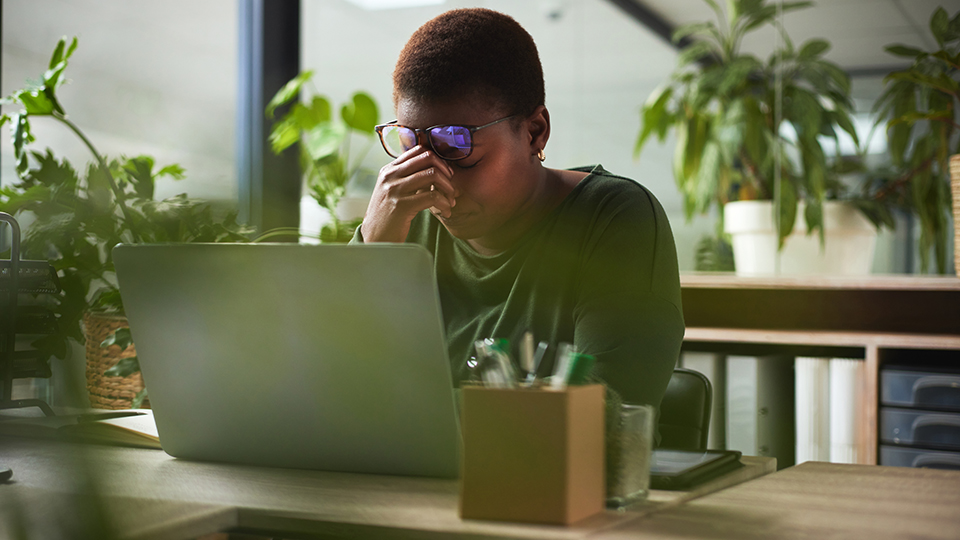 Female struggling to concentrate at work.