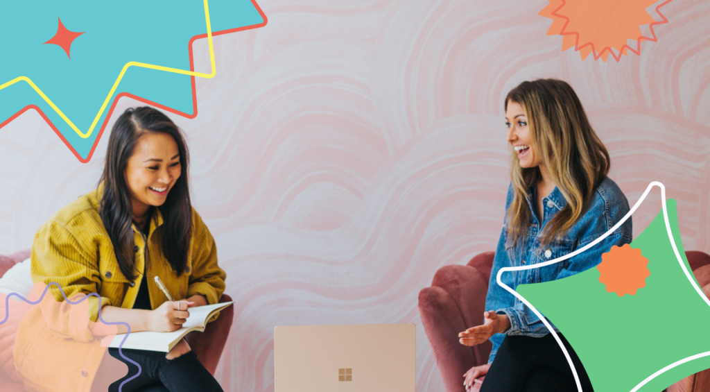 Two happy women having a delightful conversation about work