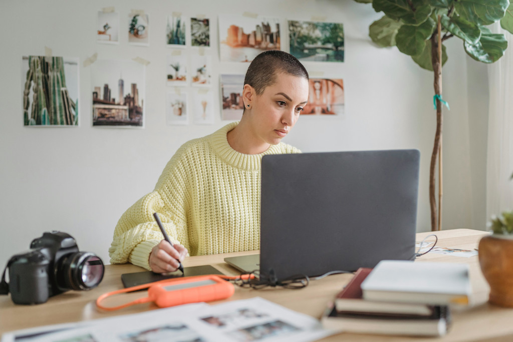 A female graphic designer doing work in her laptop