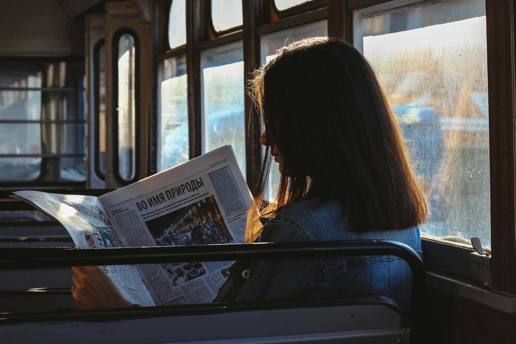 A woman reading a newspaper