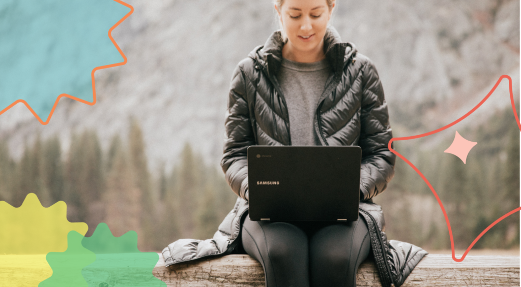 A woman working remotely in a beautiful forest scenery