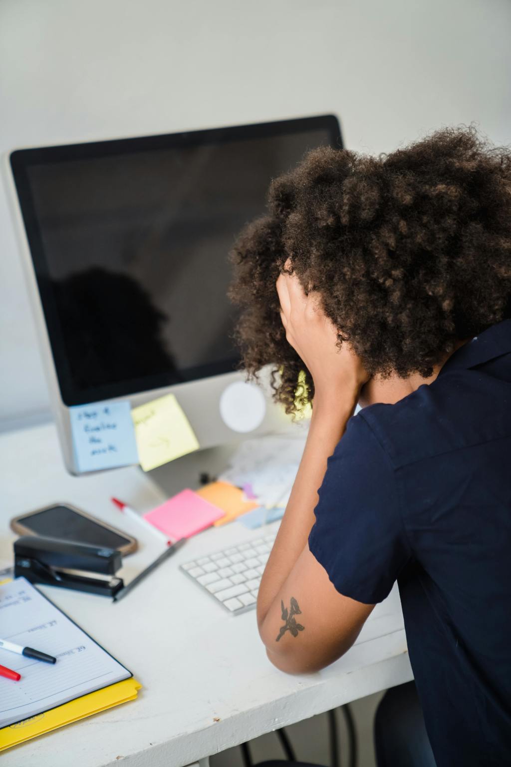 A woman slouched on the table