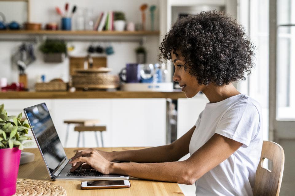 Woman using her laptop on a desk