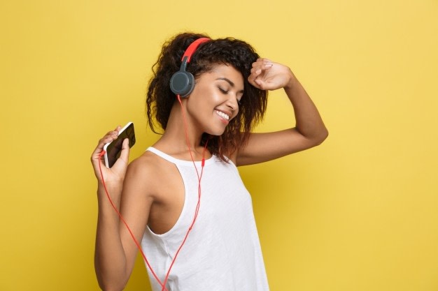 Woman listening to music with her phone