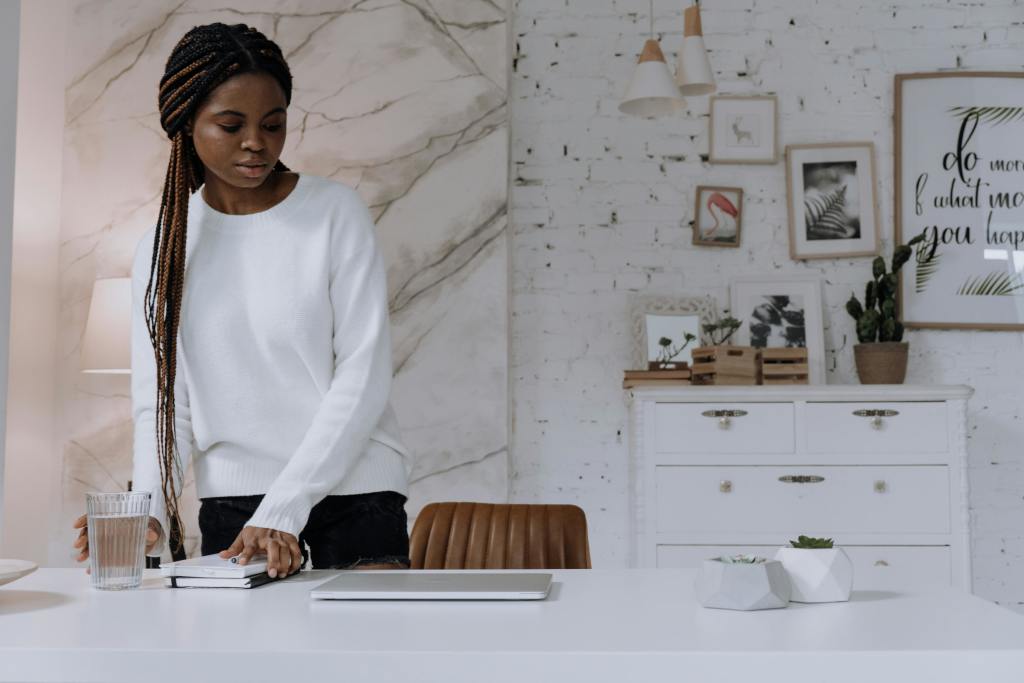 A woman preparing her remote workspace