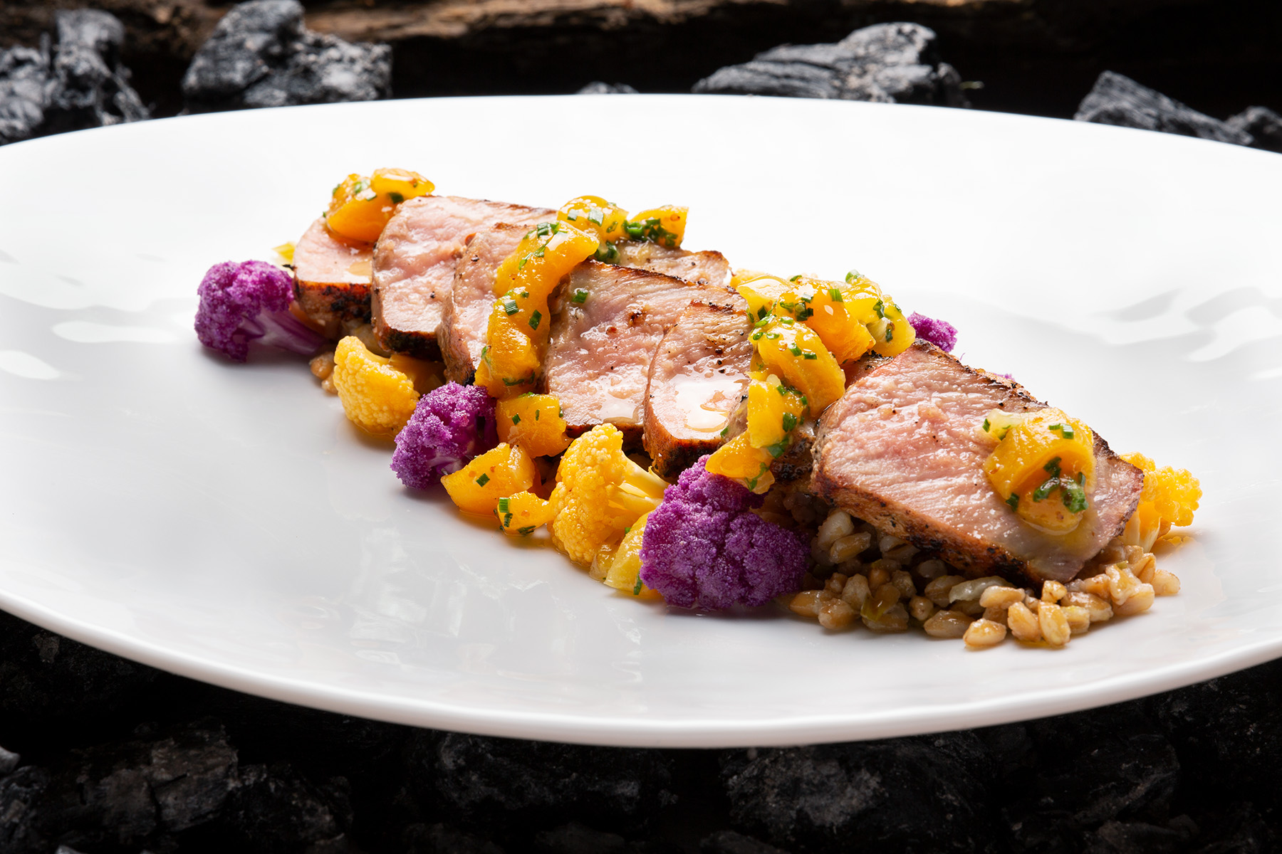 Color cauliflower, purple, orange, cauliflower, apricot, farro, Iberico, pork, charcoal, wood, grill, olive oil, main course, Cucina, Italian cuisine, fine dining, Las Vegas, photography, food, parsley