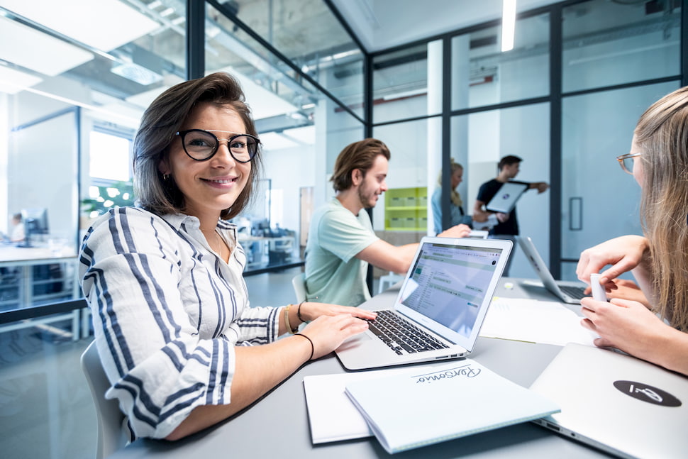 woman working on laptop smiling