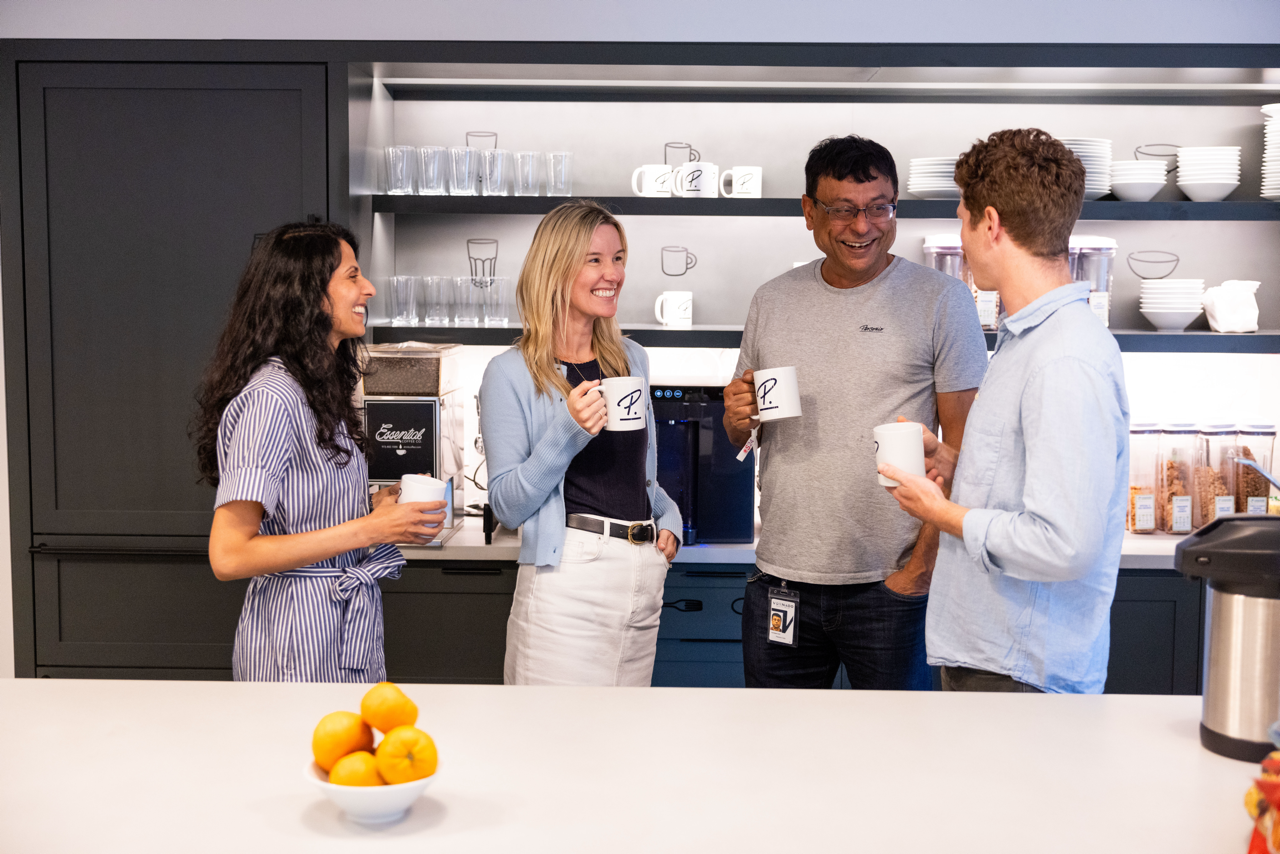 4 employees in new york office kitchen