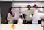 4 employees in new york office kitchen