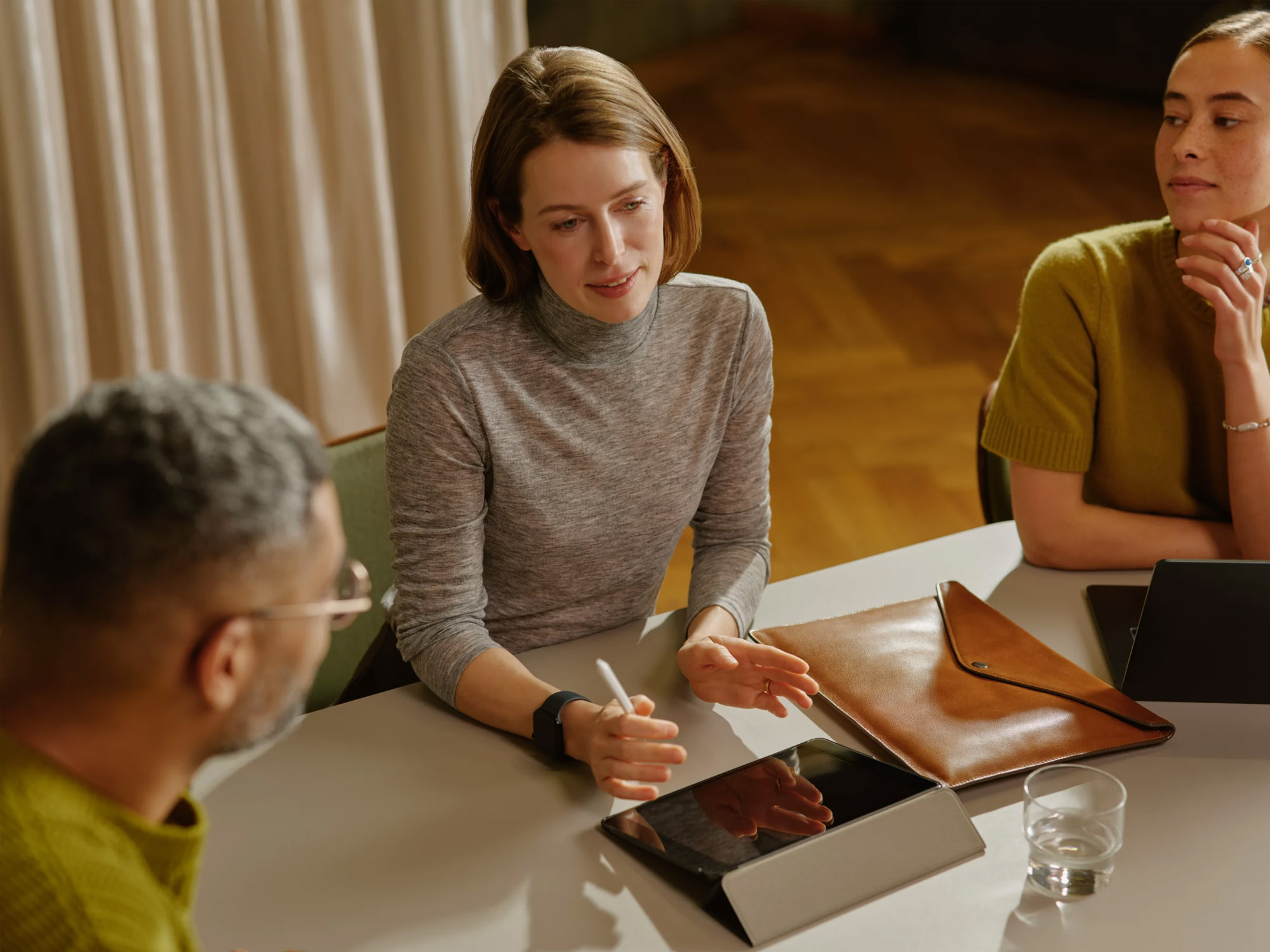 Staff discussing in an office setting