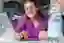 Woman looking at Laptop and Smiling