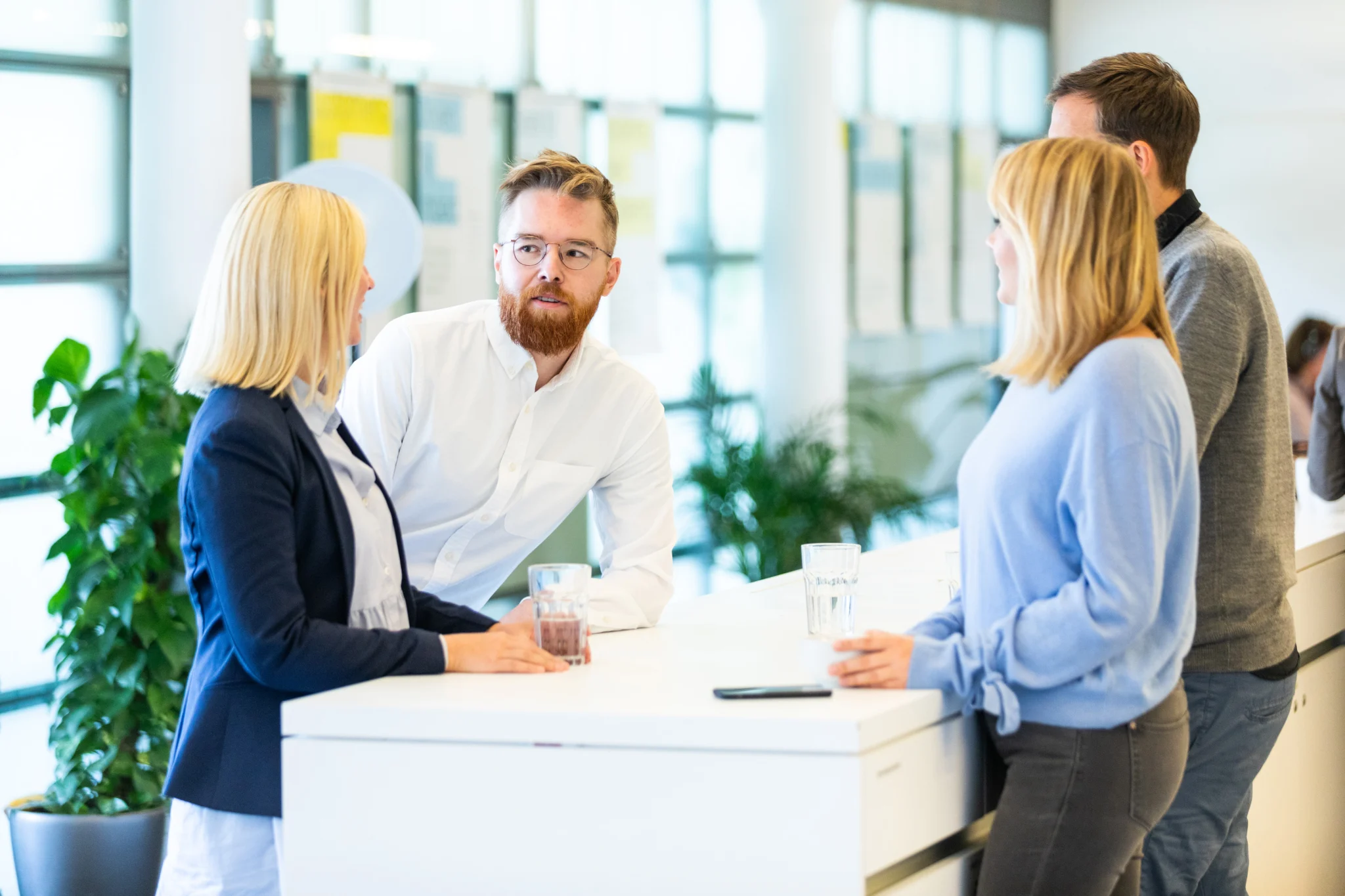 employees collaborating while hybrid working