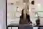 Smiling Personio Employee at Computer