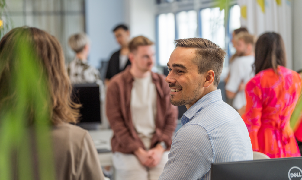 Employee talking to someone else from the side