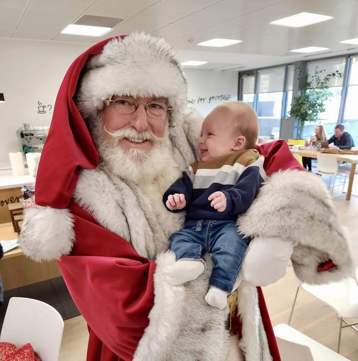 John Conneely's baby with santa at holiday party