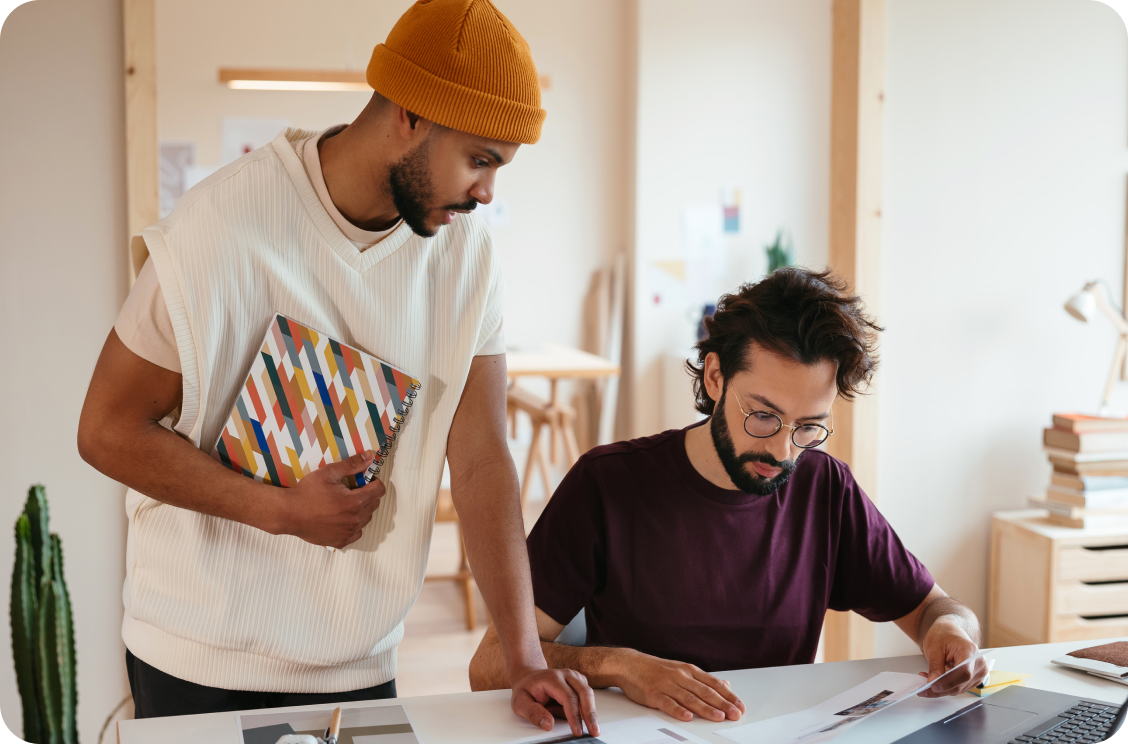 Two men looking at documents