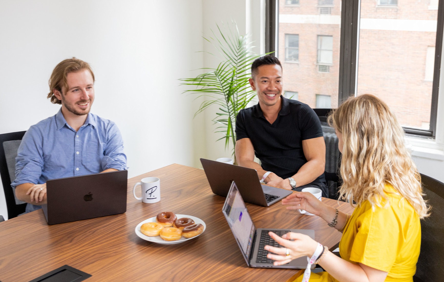 Group with laptop in New York office