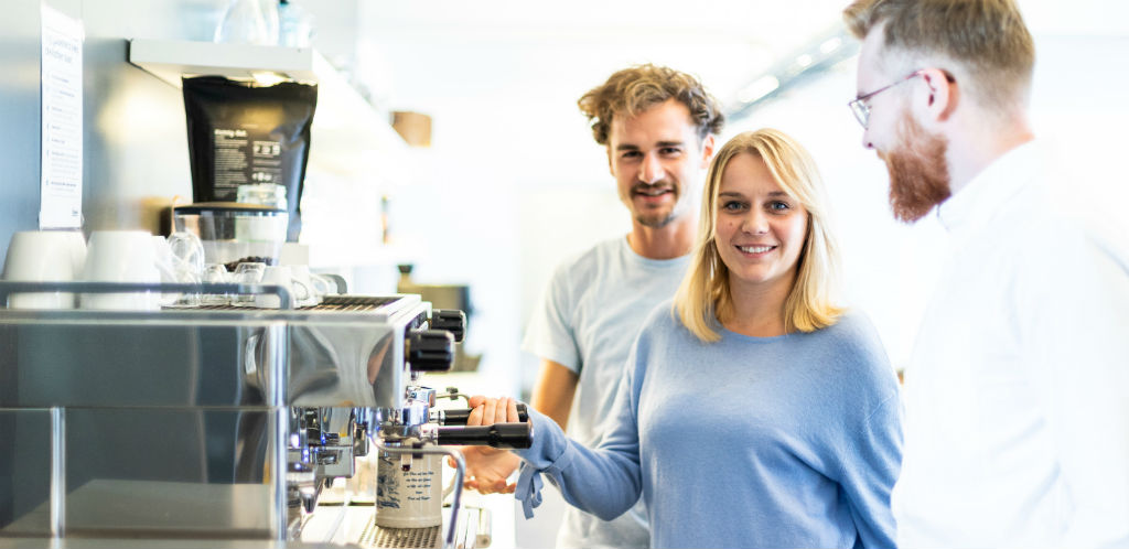 A young woman is happy about her employee benefits.