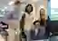4 people looking at laptop